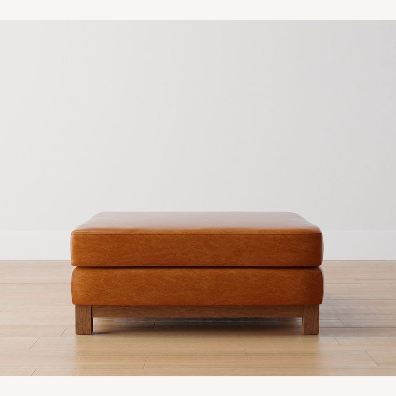 Pottery Barn Jake Light Brown Leather Ottoman - image-0