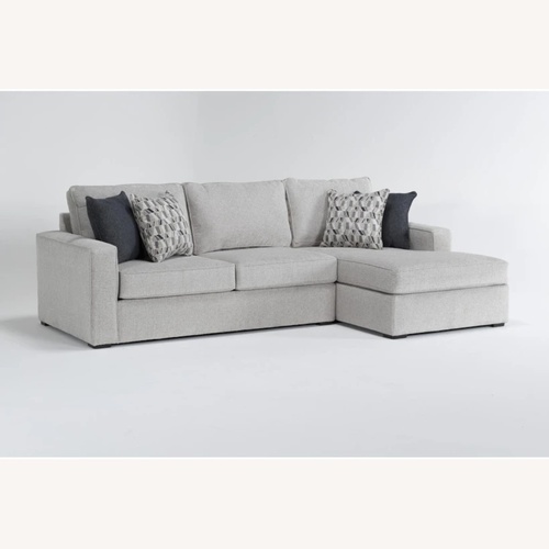 Used Living Spaces Light Gray Fabric 2 Piece Sectional for sale on AptDeco