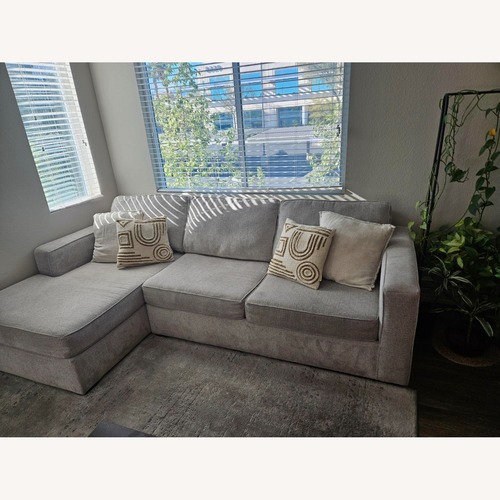 Used Living Spaces Light Gray Fabric 2 Piece Sectional for sale on AptDeco