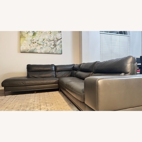Used Living Spaces Dark Gray Leather 2 Piece Sectional for sale on AptDeco