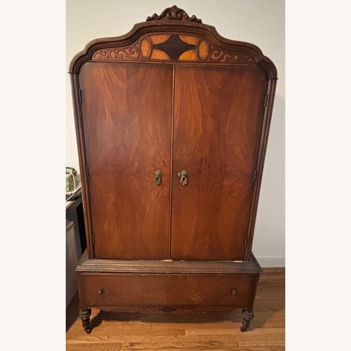 Used Dark Brown Wood Armoire for sale on AptDeco