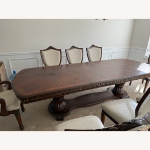 Used  Dark Wood Dining Room Set for sale on AptDeco