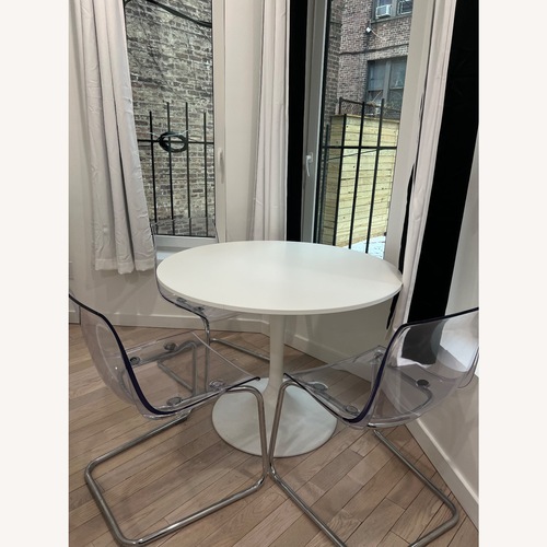 Used IKEA DOKSTA White Table and 3 Transparent Chrome Chairs for sale on AptDeco