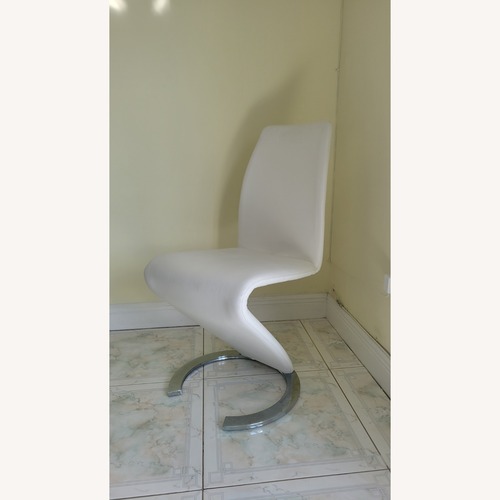 Used Safavieh White Faux Leather Dining Chairs for sale on AptDeco
