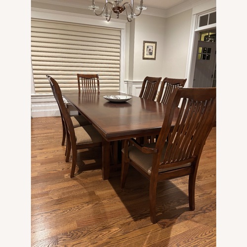 Used Jordan's Furniture Dark Brown Wood Dining Sets for sale on AptDeco