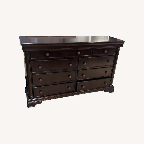 Used Ashley Furniture Cherry Brown 9-Drawer Dresser for sale on AptDeco