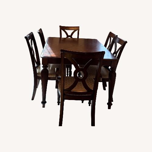 Used Dark Brown Wood Dining Table Set for sale on AptDeco