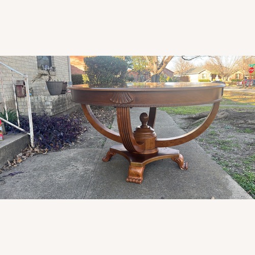 Used Dark Brown Wood Dining Table for sale on AptDeco