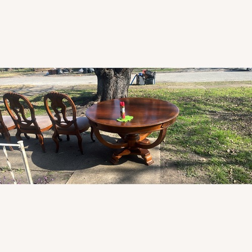 Used Dark Brown Wood Dining Table for sale on AptDeco