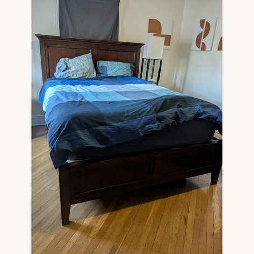Used Macy's Sanibel Dark Brown Wood Queen Bed for sale on AptDeco
