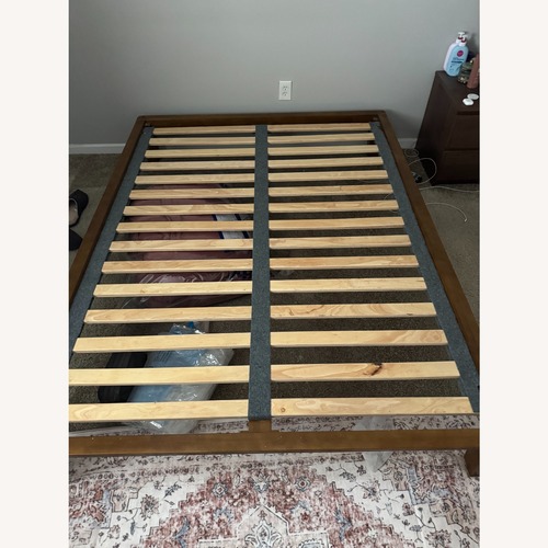 Used Thuma Dark Brown Wood Queen Bed for sale on AptDeco