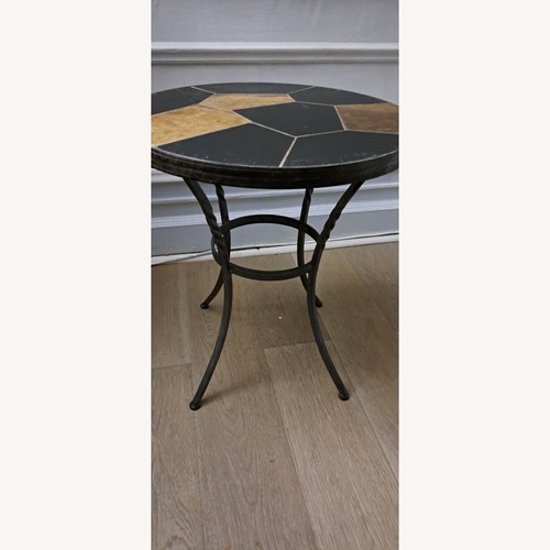 Used Small Round Cast Iron Table for sale on AptDeco