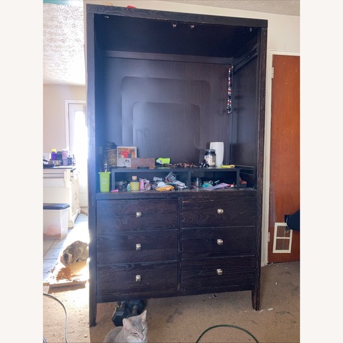 Used Dark Brown Wood Armoire for sale on AptDeco