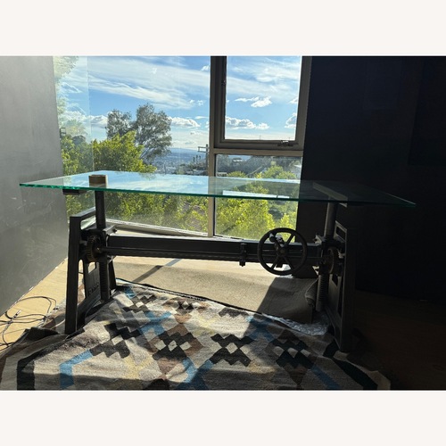 Used Rare Industrial Lift-Base Desk with Glass Top for sale on AptDeco