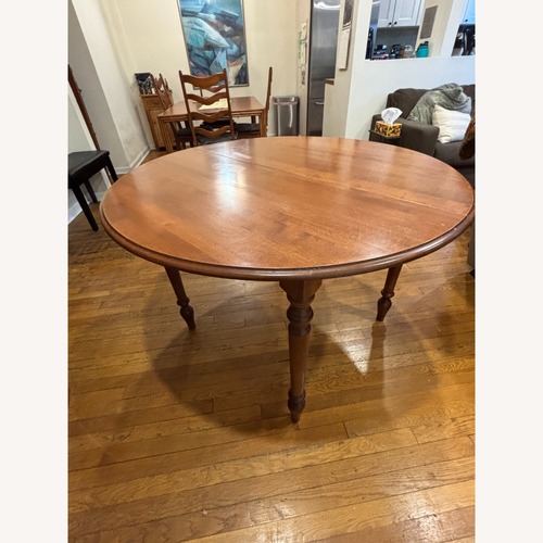 Used Antique Circular Dining Table for sale on AptDeco