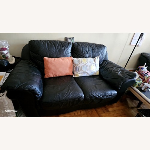 Used Vintage/Antique Black Leather Loveseat for sale on AptDeco