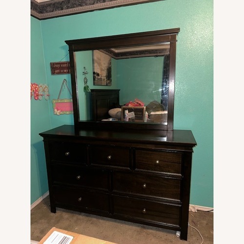Used Ashley Furniture Dark Brown Dresser with Mirror for sale on AptDeco