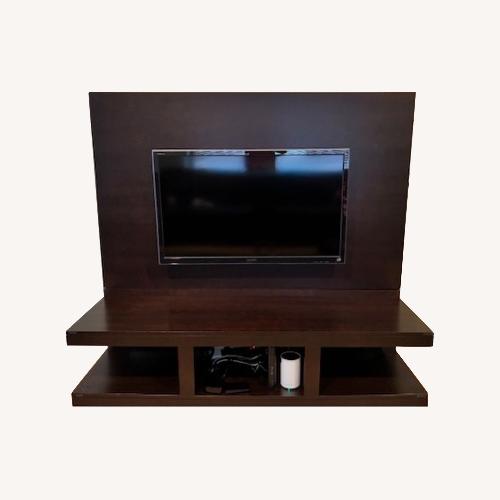 Used Modern Dark Wood Entertainment Stand for sale on AptDeco