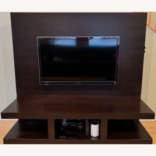 Used Modern Dark Wood Entertainment Stand for sale on AptDeco