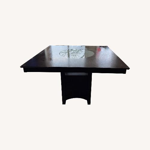 Used Dark Brown Wood Dining Table for sale on AptDeco