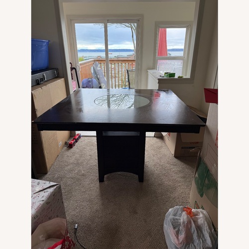 Used Dark Brown Wood Dining Table for sale on AptDeco