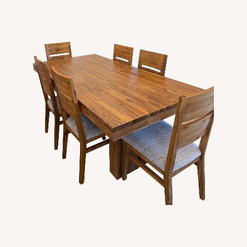 Used Macy's Light Brown Wood Dining Table for sale on AptDeco