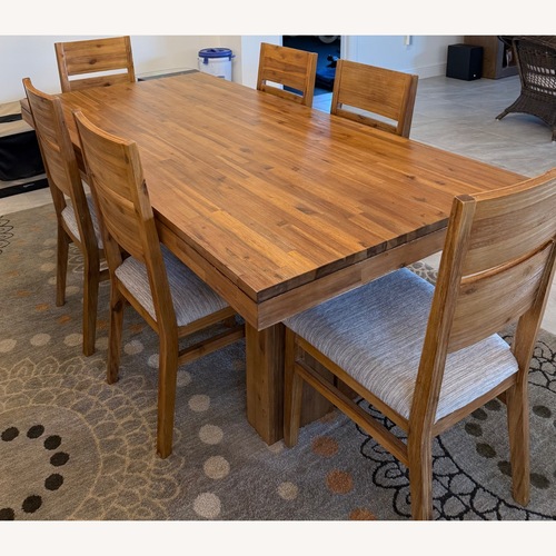 Used Macy's Light Brown Wood Dining Table for sale on AptDeco