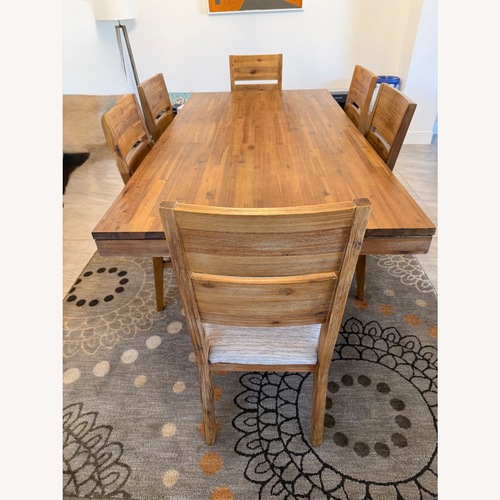 Used Macy's Light Brown Wood Dining Table for sale on AptDeco