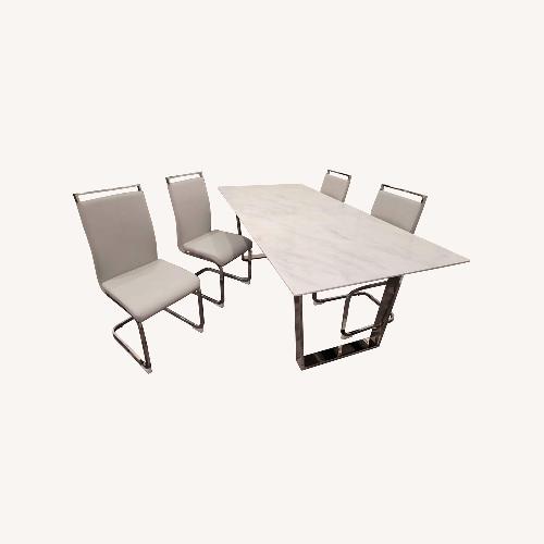 Used Hibbard Stone Top Dining Table With Chairs for sale on AptDeco