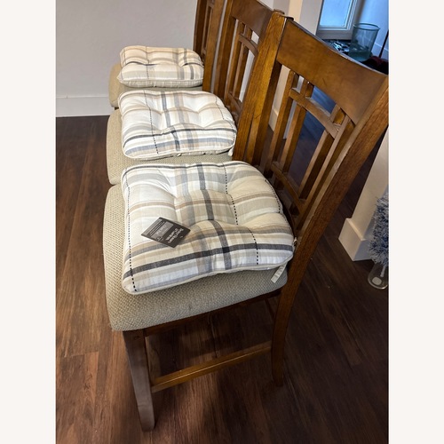 Used IKEA Dark Brown Wood Dining Chairs for sale on AptDeco