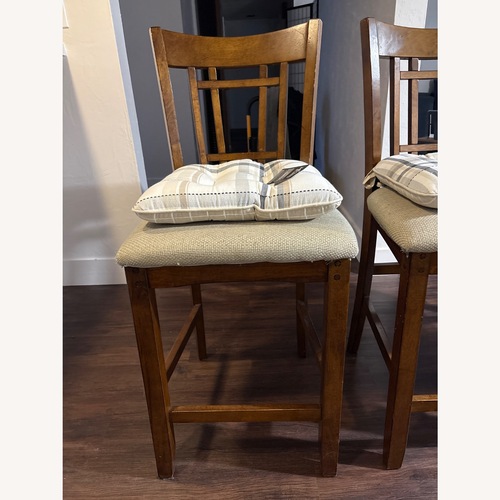 Used IKEA Dark Brown Wood Dining Chairs for sale on AptDeco
