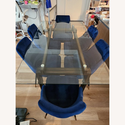 Used Modern Glass Dining Table + 6 Blue Velvet Chairs for sale on AptDeco