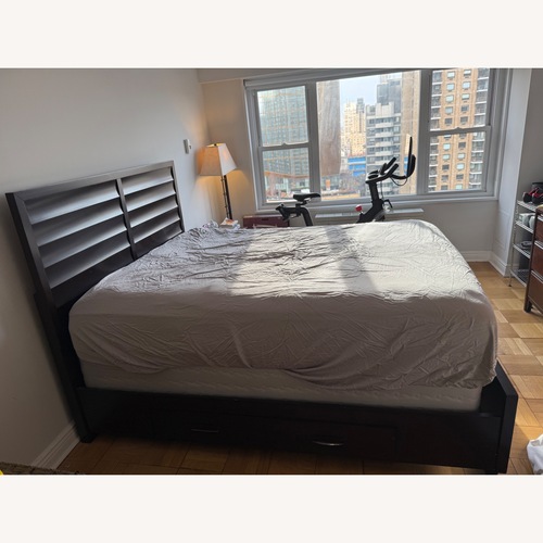 Used Macy's Dark Brown Wood Queen 4-Drawer Storage Bed for sale on AptDeco