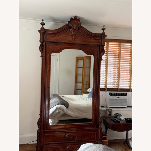 Used Dark Brown Mahogany Wood Armoire for sale on AptDeco