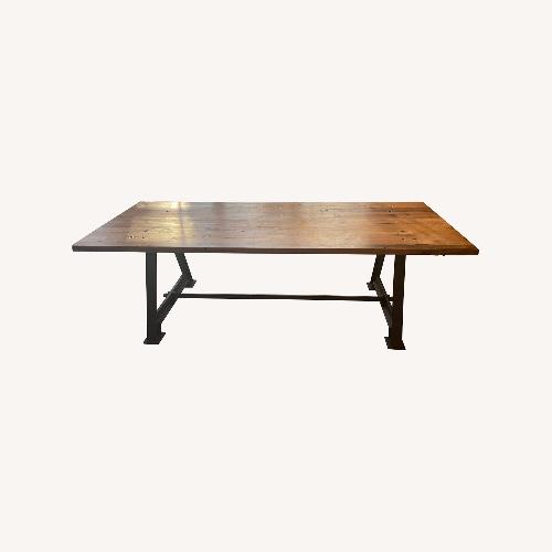 Used Dark Brown Industrial Wood Dining Table for sale on AptDeco