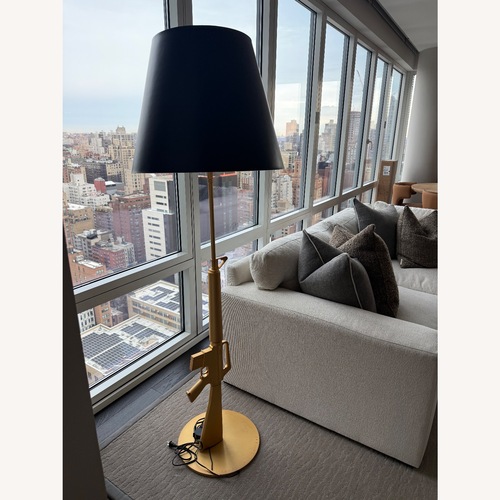Used Flos Black Exquisite FLOS Guns Metal Floor Lamp for sale on AptDeco