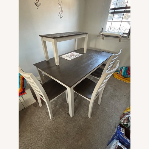 Used Light Brown Wood Dining Table for sale on AptDeco