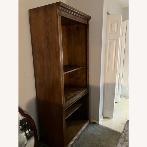 Used Vintage/Antique Dark Brown Wood Bookcase for sale on AptDeco