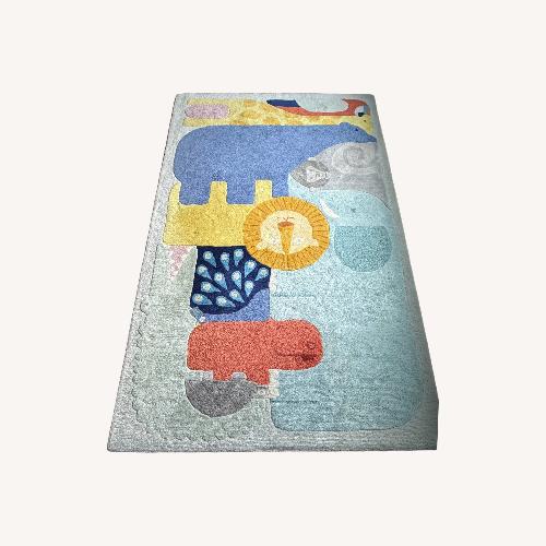 Used Crate & Kids Animal Wool Area Rug 5' x 8' and Pad for sale on AptDeco