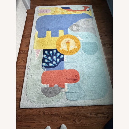 Used Crate & Kids Animal Wool Area Rug 5' x 8' and Pad for sale on AptDeco