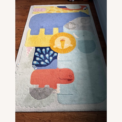 Used Crate & Kids Animal Wool Area Rug 5' x 8' and Pad for sale on AptDeco