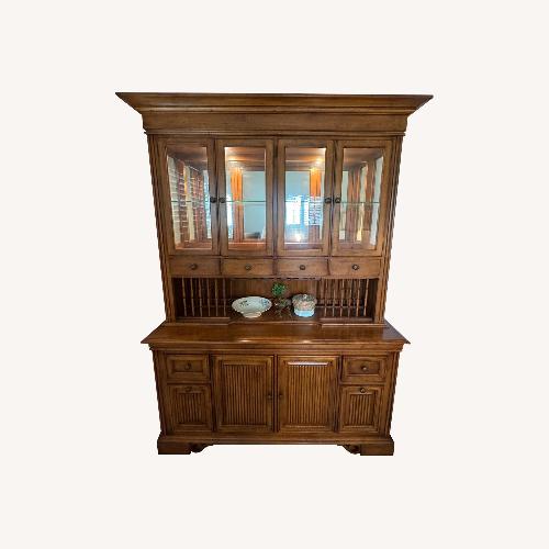 Used Tommy Bahama Dark Brown Wood Armoire for sale on AptDeco