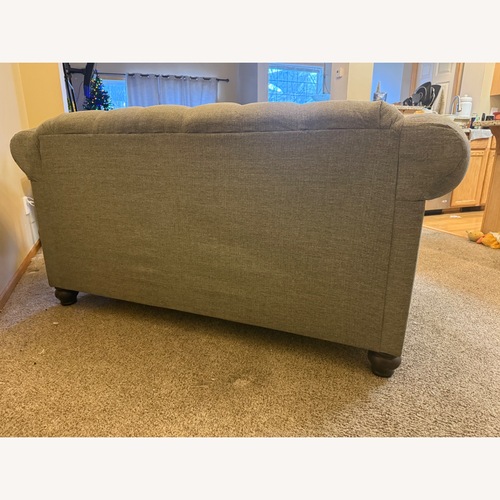 Used Dark Gray Tufted Loveseat for sale on AptDeco