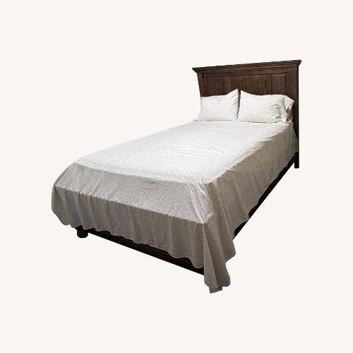 Used Ashley Furniture Light Brown Wood Queen Bed for sale on AptDeco