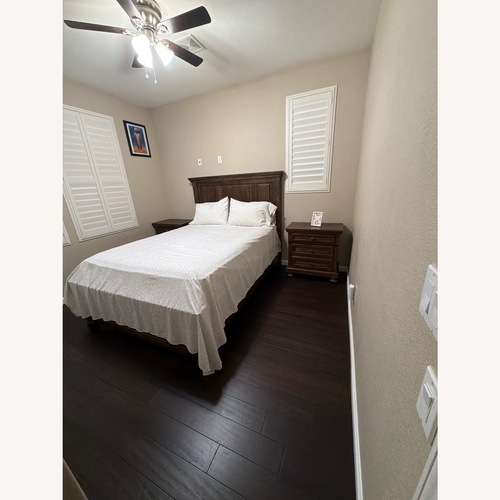 Used Ashley Furniture Light Brown Wood Queen Bed for sale on AptDeco