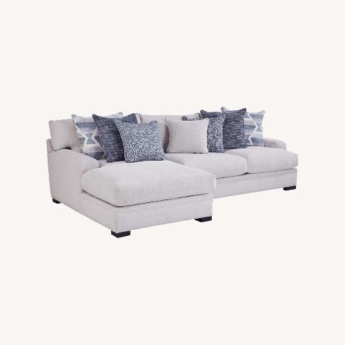 Used Rooms To Go White 2 Piece Sectional for sale on AptDeco