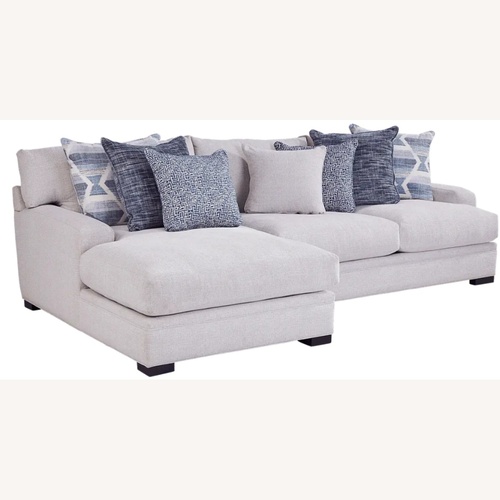 Used Rooms To Go White 2 Piece Sectional for sale on AptDeco