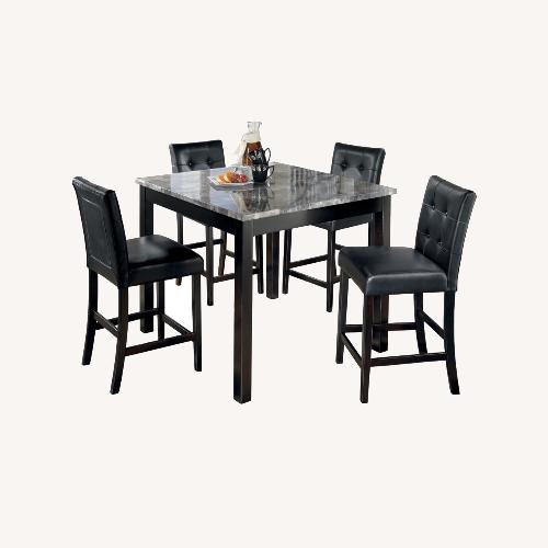 Used Ashley Furniture Maysville Counter Height Dining Table and 4 Bar Stools for sale on AptDeco