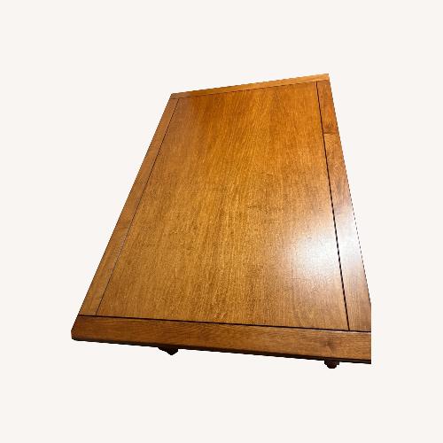 Used Dark Brown Wood Dining Table for sale on AptDeco
