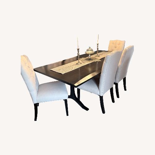 Used Arhaus Dark Brown Wood Dining Table for sale on AptDeco